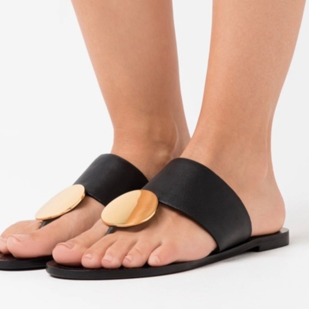 Tory Burch Black and Gold Slide Sandals with Modern Design